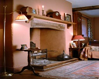 What paint I use to paint behind wood burners and fireplace surrounds?
