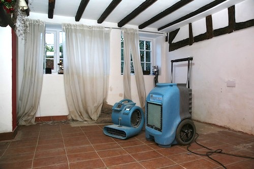 Image: Background heating and dehumidifiers can help dry out buildings after flooding Credit: ©Roger Hunt 